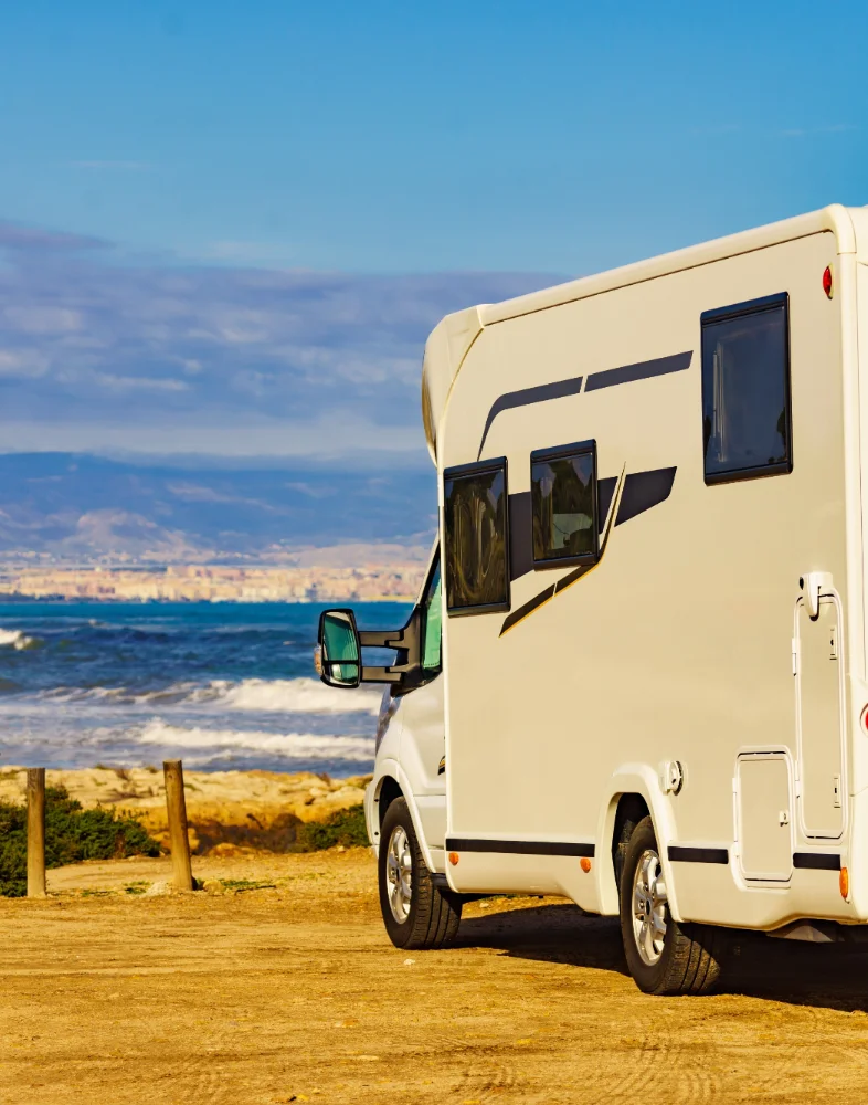 motorhome parked by the beach